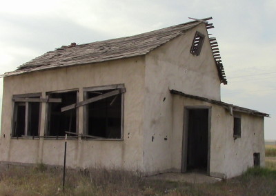 Broken down house in Kansas, traveling to Monument Rocks. Photograph by Johnna M. Gale